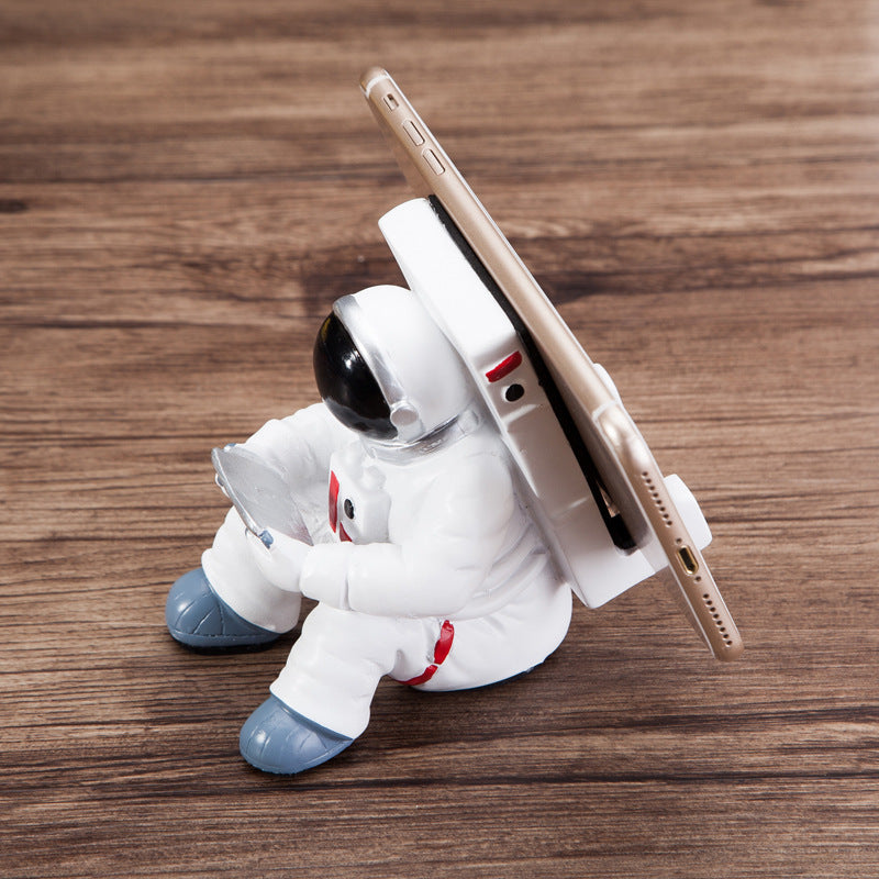 シンプルな宇宙飛行士の携帯電話スタンド 学生用デスクトップホルダー かわいい宇宙飛行士の携帯電話ホルダー クリエイティブギフト 小さなデスク装飾